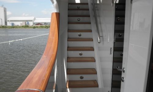 Photo of teak handrail and steps on a yacht
